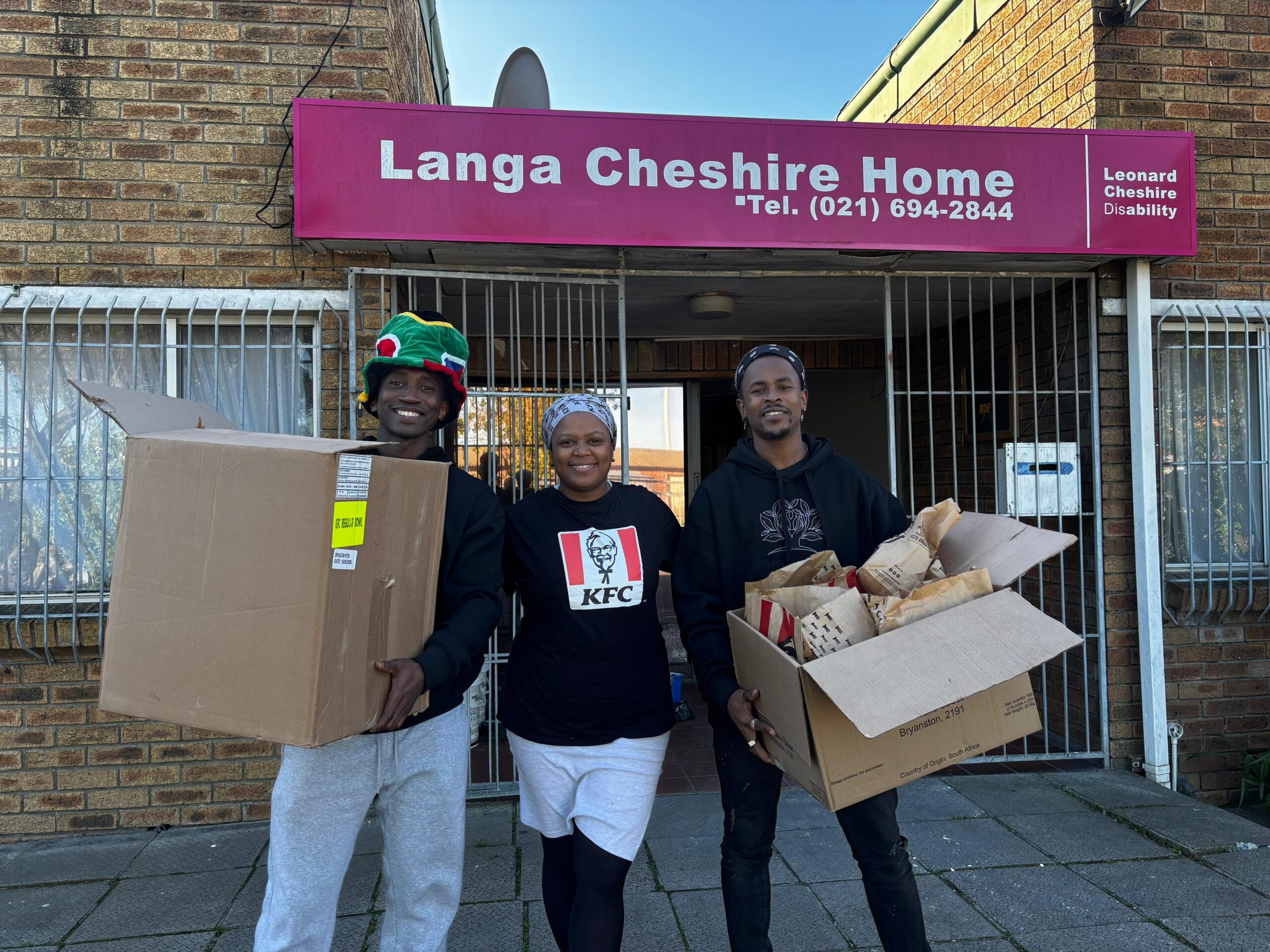 Volunteers arriving at Langa Cheshire Home with boxes of donations