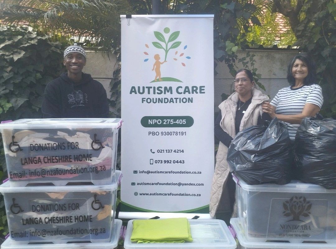 Autism Care Foundation volunteers with donation boxes for Langa Cheshire Home